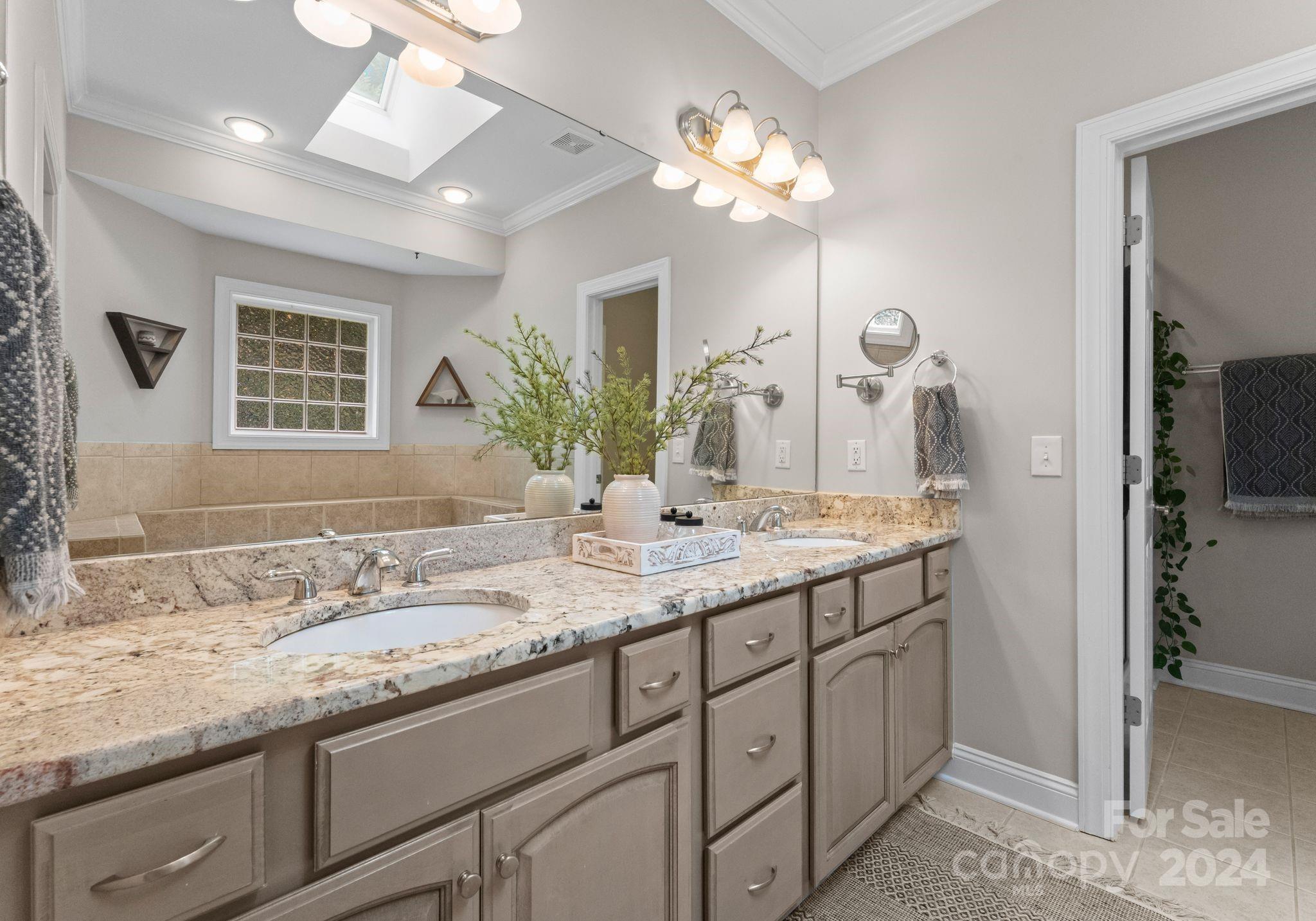 687 Normandy Road Mooresville, NC 28117 - Photo 21 of 32 a bathroom with a granite countertop sink and a mirror