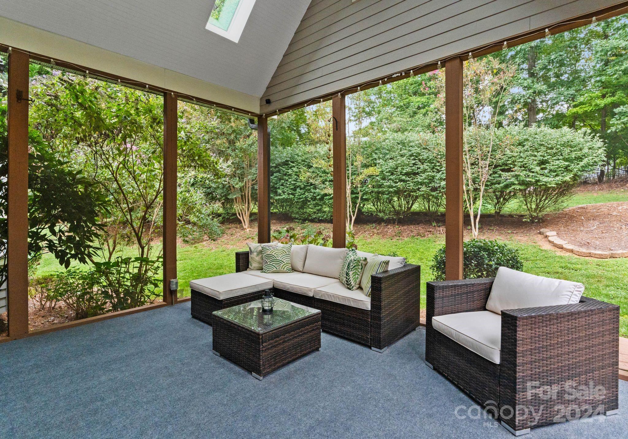 687 Normandy Road Mooresville, NC 28117 - Photo 23 of 32 a living room with furniture and a floor to ceiling window