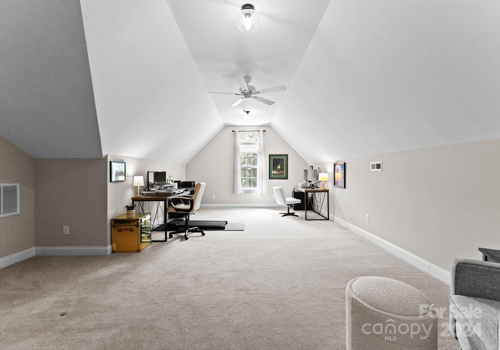 687 Normandy Road Mooresville, NC 28117 - Photo 29 of 32 a view of a livingroom with furniture and a ceiling fan