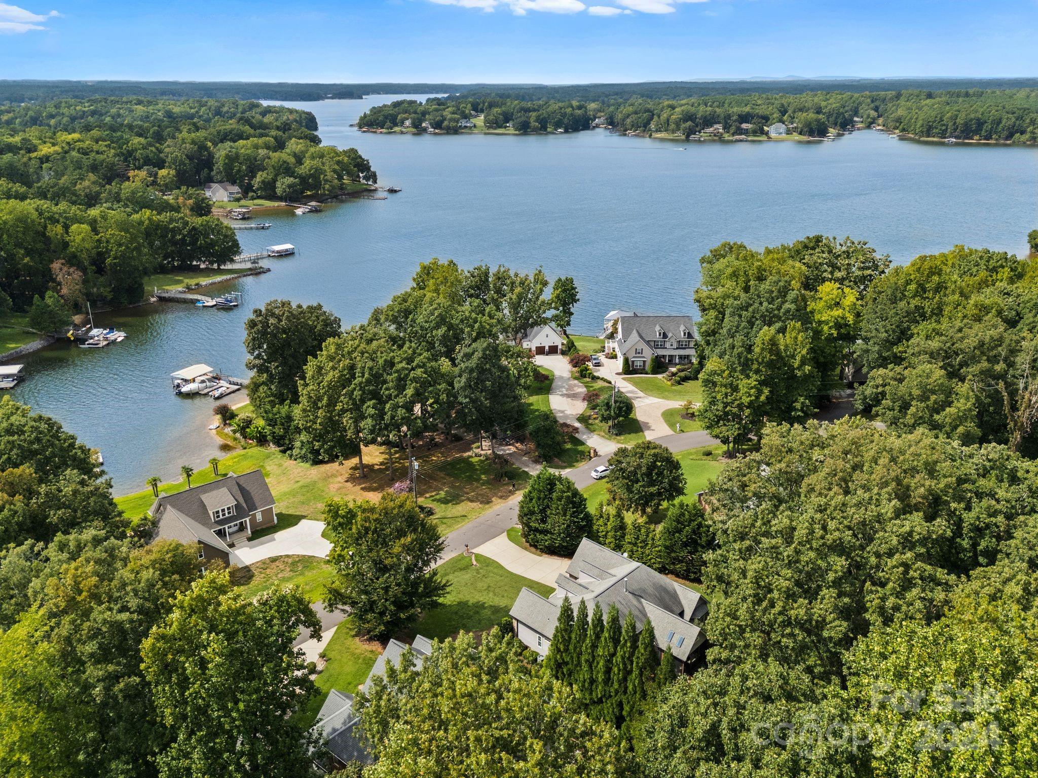 687 Normandy Road Mooresville, NC 28117 - Photo 3 of 32 an aerial view of a houses with a lake view