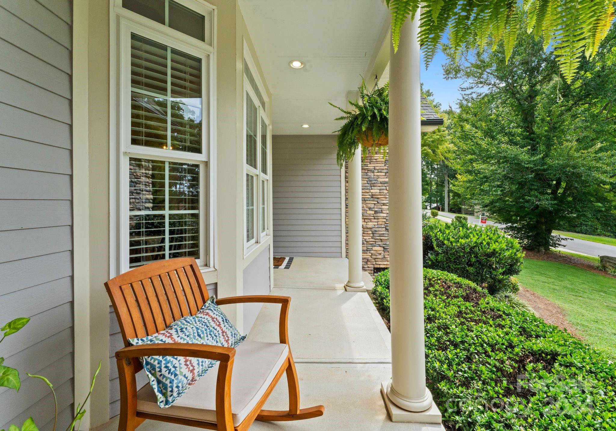 687 Normandy Road Mooresville, NC 28117 - Photo 6 of 32 a view of balcony with two chairs and potted plants