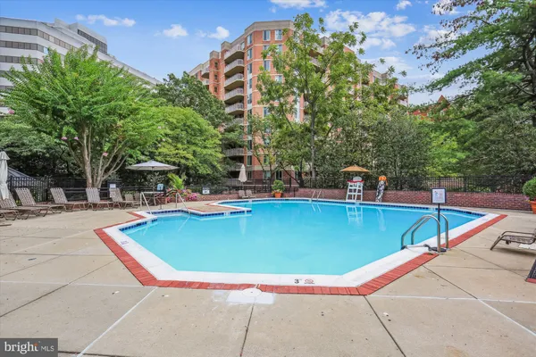 a view of a swimming pool with a patio