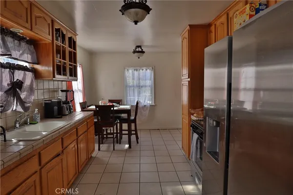 a kitchen with refrigerator cabinets and furniture