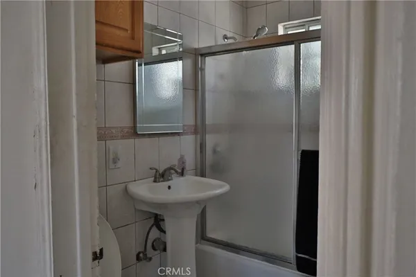 a bathroom with a sink and mirror
