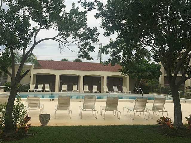 150 Pineview Road, Unit D7 Jupiter, FL 33469 - Photo 16 of 16 a view of house with swimming pool and patio