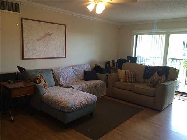 150 Pineview Road, Unit D7 Jupiter, FL 33469 - Photo 3 of 16 a living room with furniture and a window