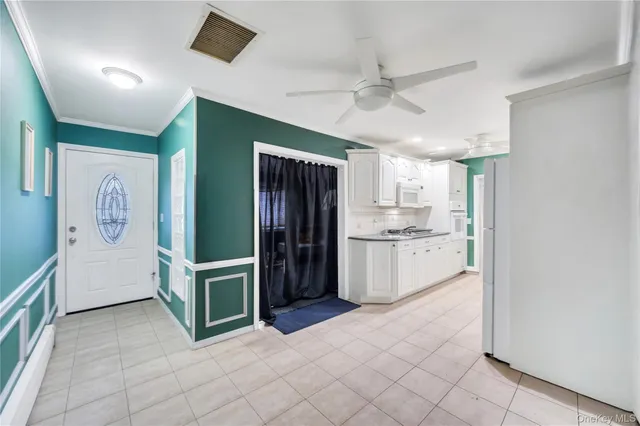 a kitchen with a refrigerator and a sink