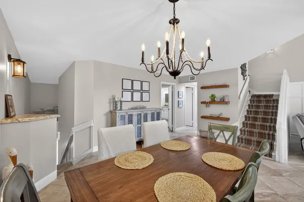 a living room with furniture and white walls