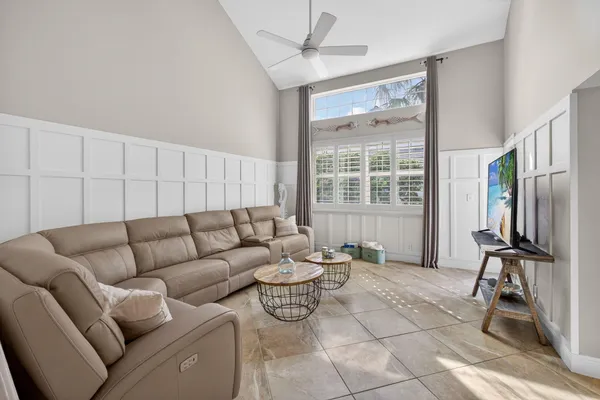 a living room with furniture and a large window