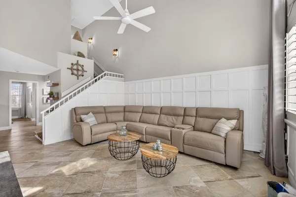 a kitchen with granite countertop white cabinets and appliances