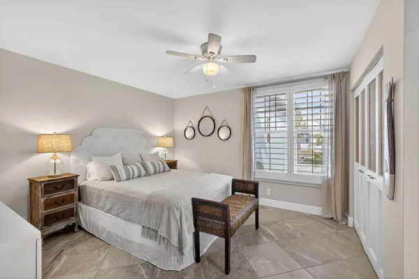 a bathroom with a granite countertop sink a mirror and a shower
