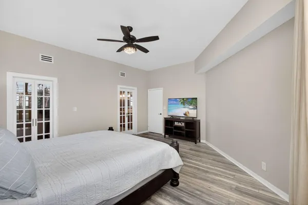 a bathroom with a granite countertop sink a mirror and a shower