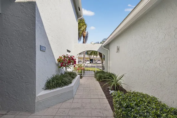 a view of a dining room with furniture and a chandelier