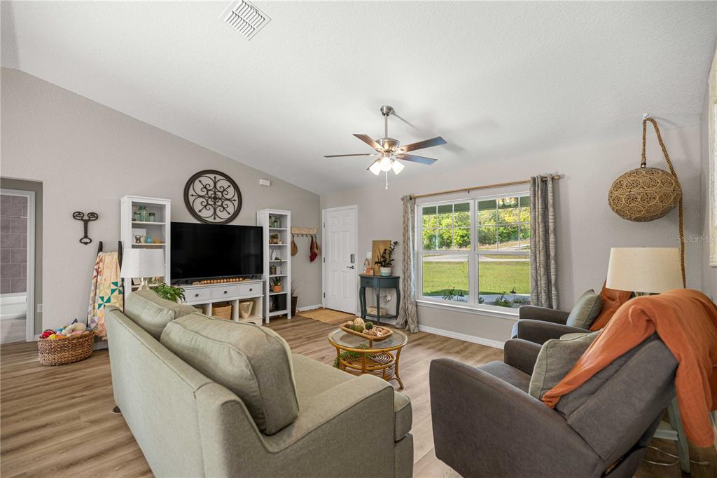 279 Southwest Fig Tree Lane Dunnellon, FL 34431 - Photo 12 of 33 a living room with furniture and a flat screen tv