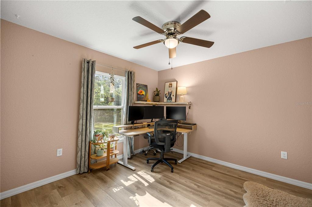 279 Southwest Fig Tree Lane Dunnellon, FL 34431 - Photo 22 of 33 a view of a workspace with furniture and a window