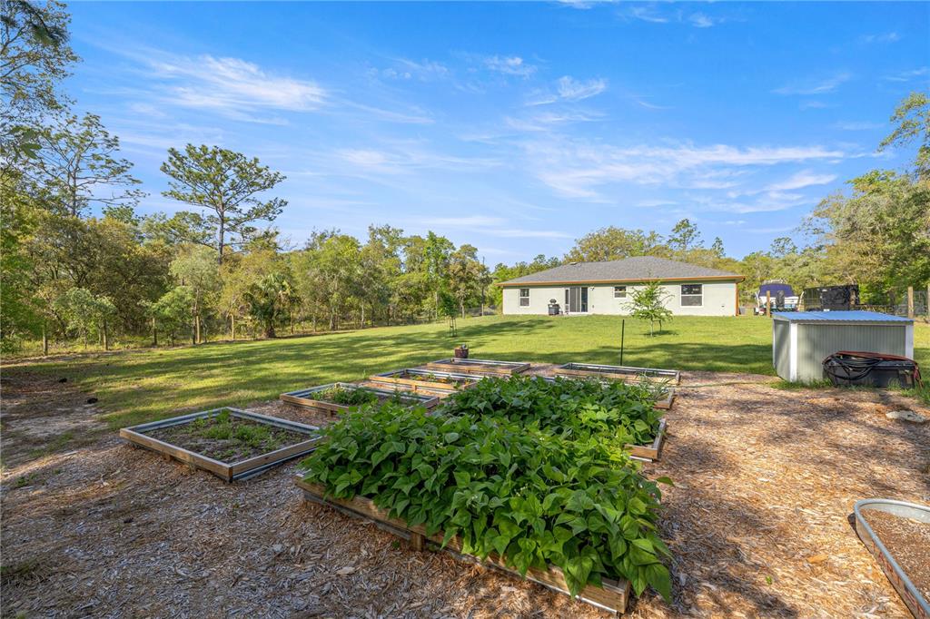 279 Southwest Fig Tree Lane Dunnellon, FL 34431 - Photo 25 of 33 a view of a house with a yard