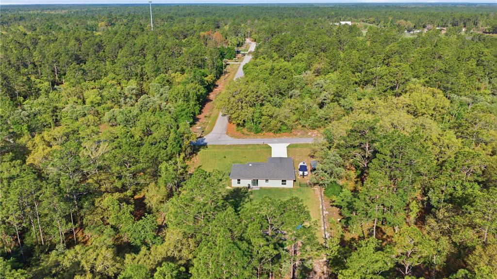 279 Southwest Fig Tree Lane Dunnellon, FL 34431 - Photo 32 of 33 an aerial view of a house with a yard