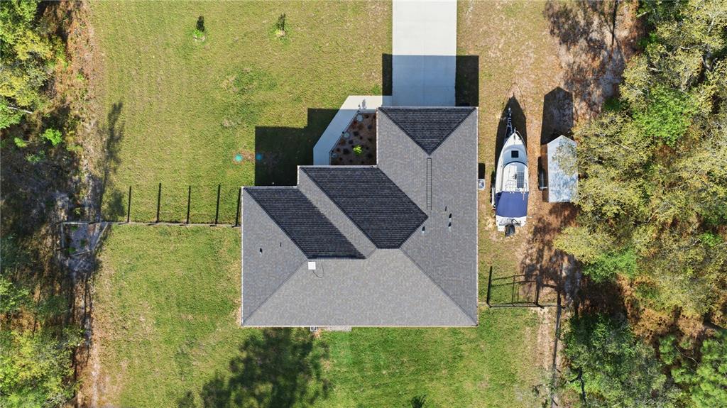 279 Southwest Fig Tree Lane Dunnellon, FL 34431 - Photo 5 of 33 an aerial view of a house with swimming pool
