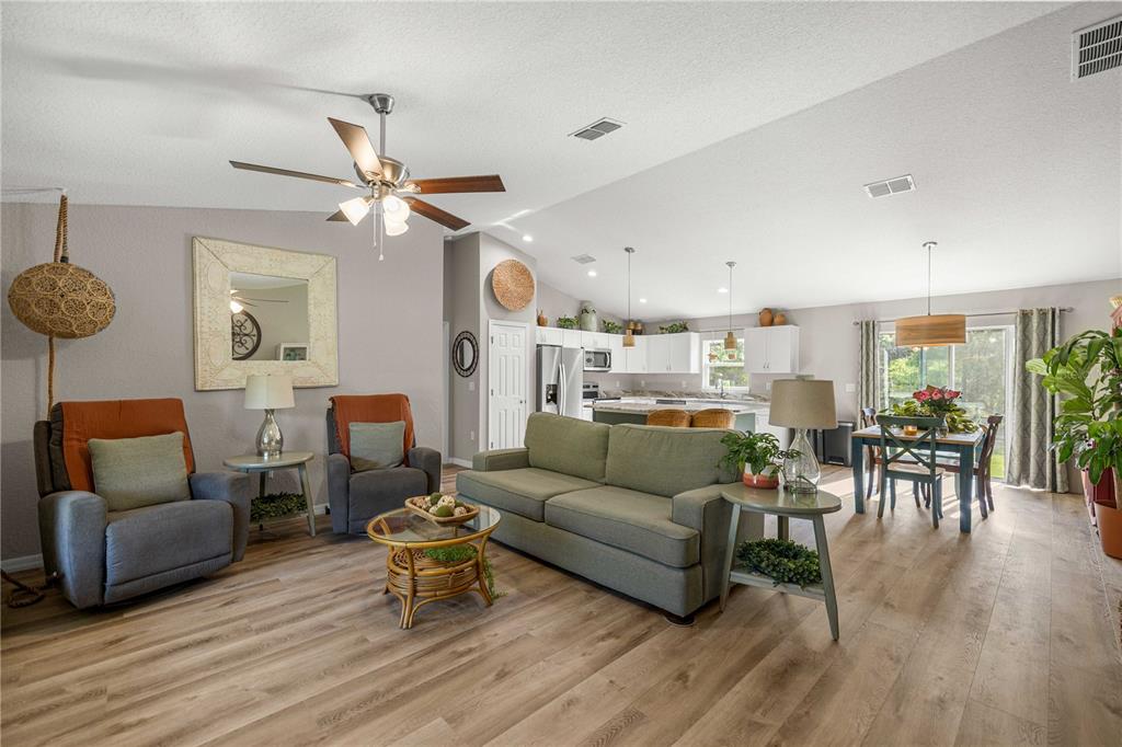 279 Southwest Fig Tree Lane Dunnellon, FL 34431 - Photo 7 of 33 a living room with furniture and a wooden floor
