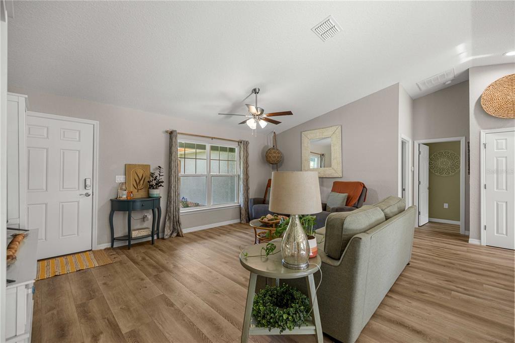 279 Southwest Fig Tree Lane Dunnellon, FL 34431 - Photo 8 of 33 a living room with furniture and wooden floor