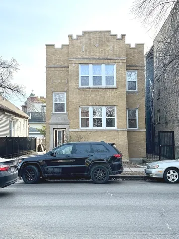 a car parked in front of a house
