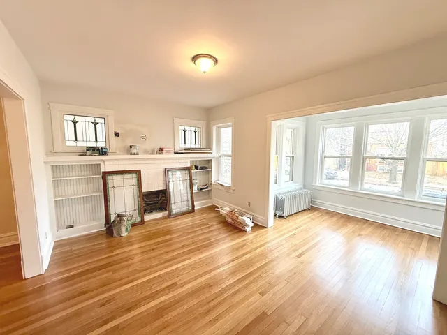 a view of a living room hardwood and a kitchen