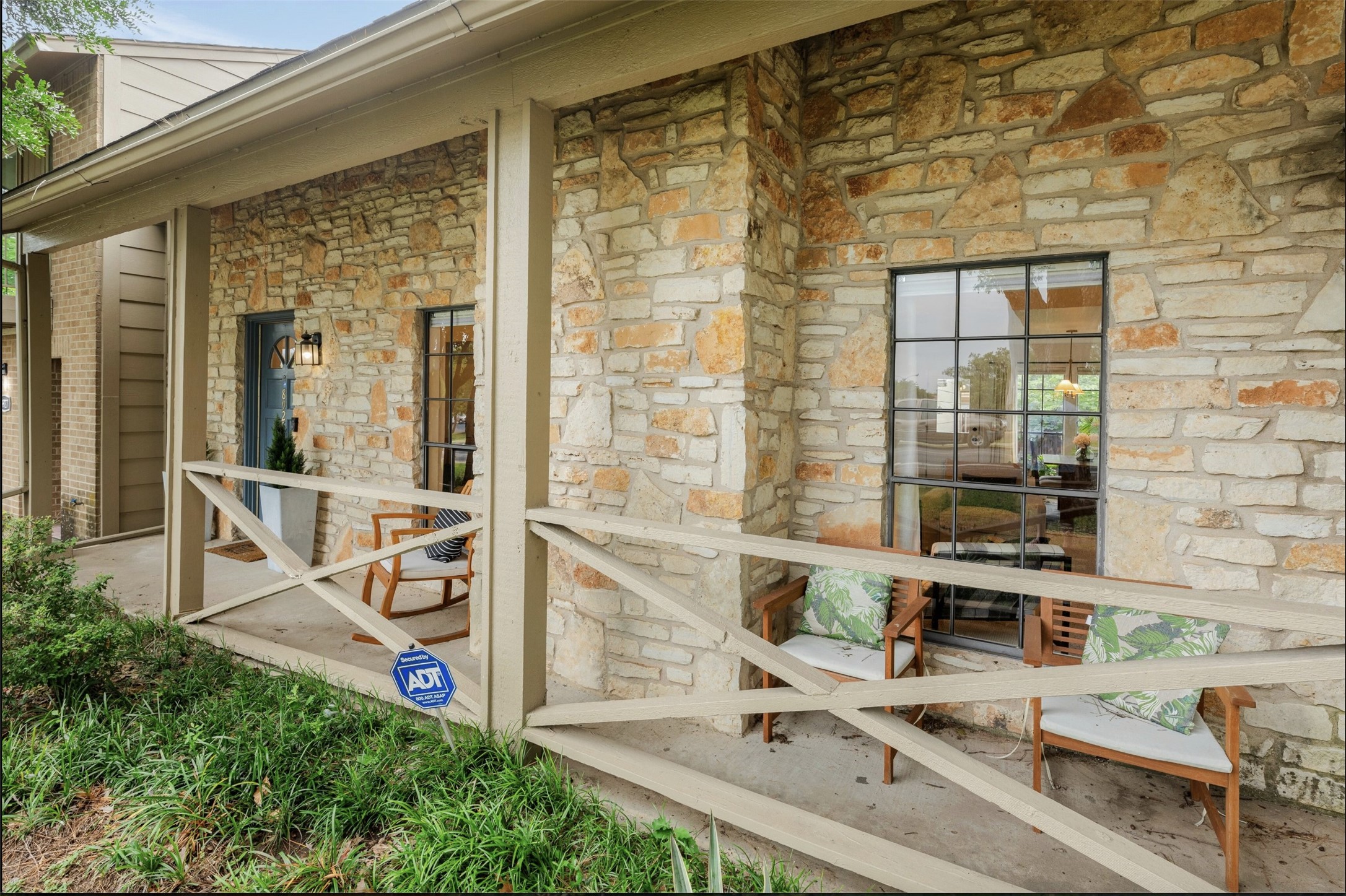 8925 North Plaza, Unit 69 Austin, TX 78753 - Photo 5 of 29 Doorway to property featuring stone siding