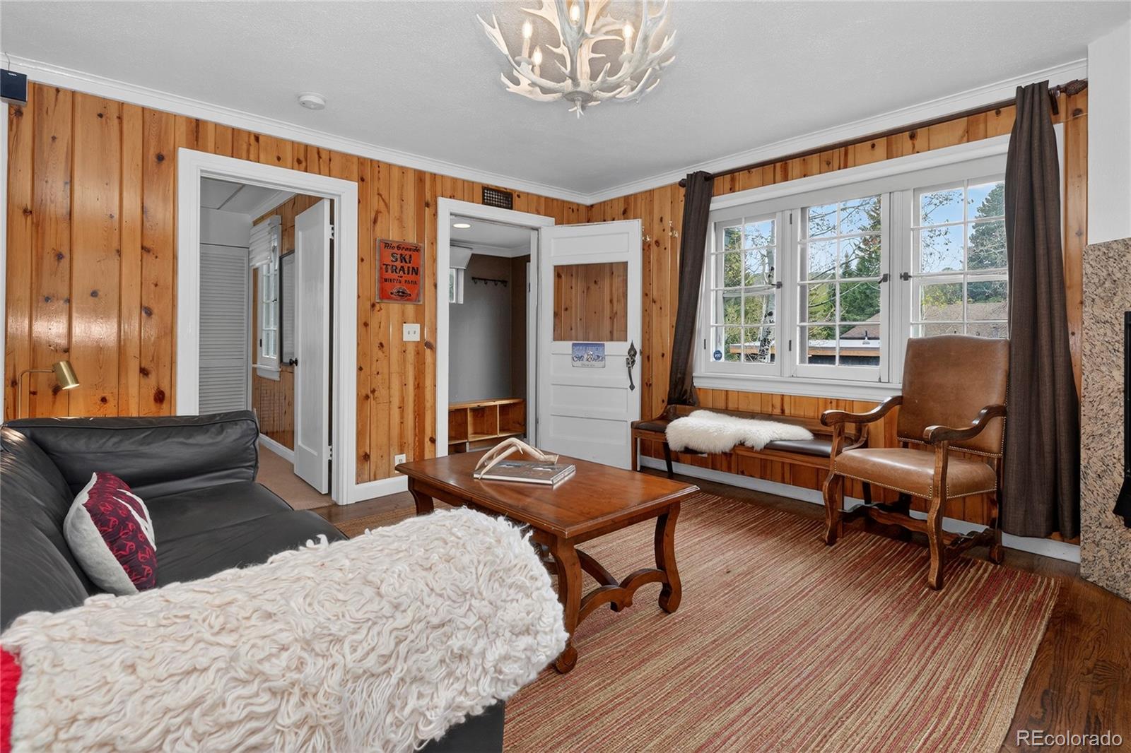 327 Vasquez Road, Unit E1 Winter Park, CO 80482 - Photo 18 of 43 a bedroom with a bed and wooden floor