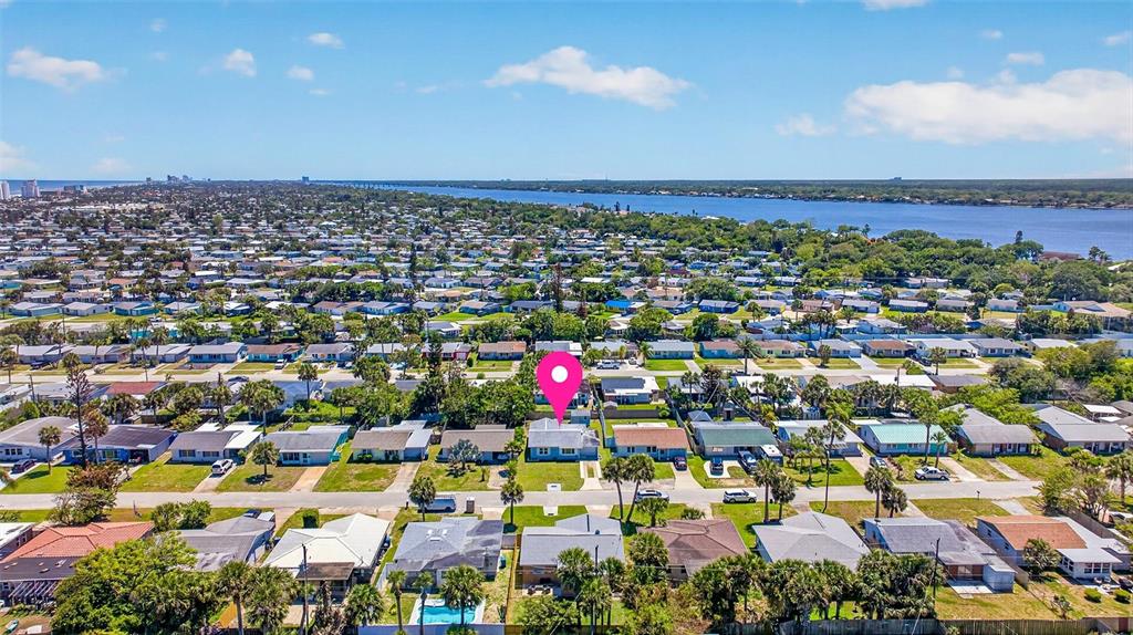 47 Carol Road Ormond Beach, FL 32176 - Photo 42 of 54 an aerial view of a houses with a swimming pool