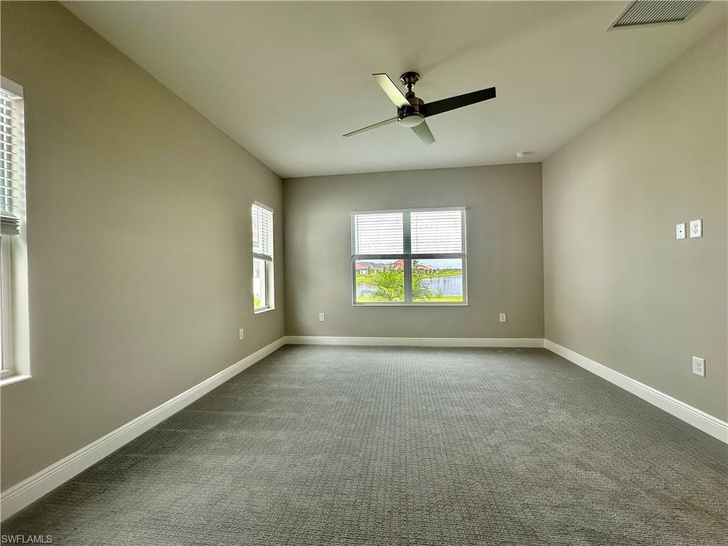 4580 Centaurus Circle Naples, FL 34120 - Photo 7 of 25 Spare room with ceiling fan and carpet floors