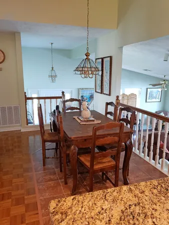 a view of a dining room with furniture