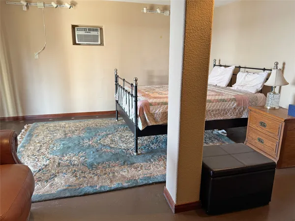 a view of a livingroom with furniture and a rug