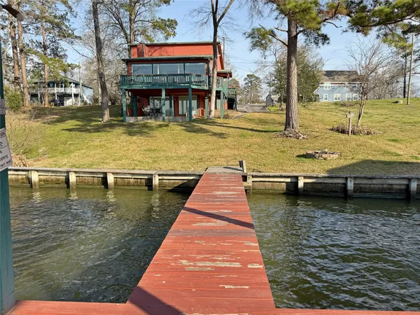 a view of swimming pool with outdoor seating