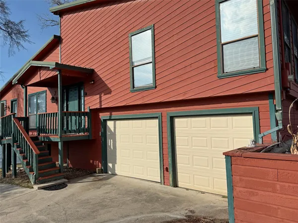 a front view of a house with parking space