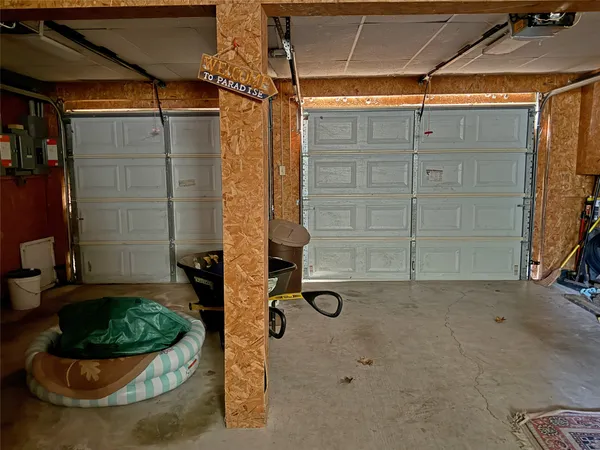 a view of a room with water heater and racks