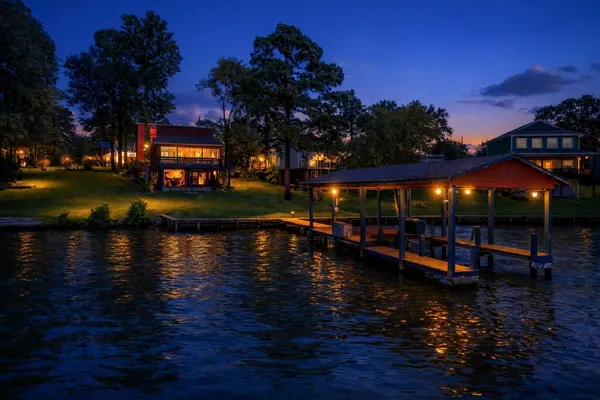 a view of a lake with a house in the background