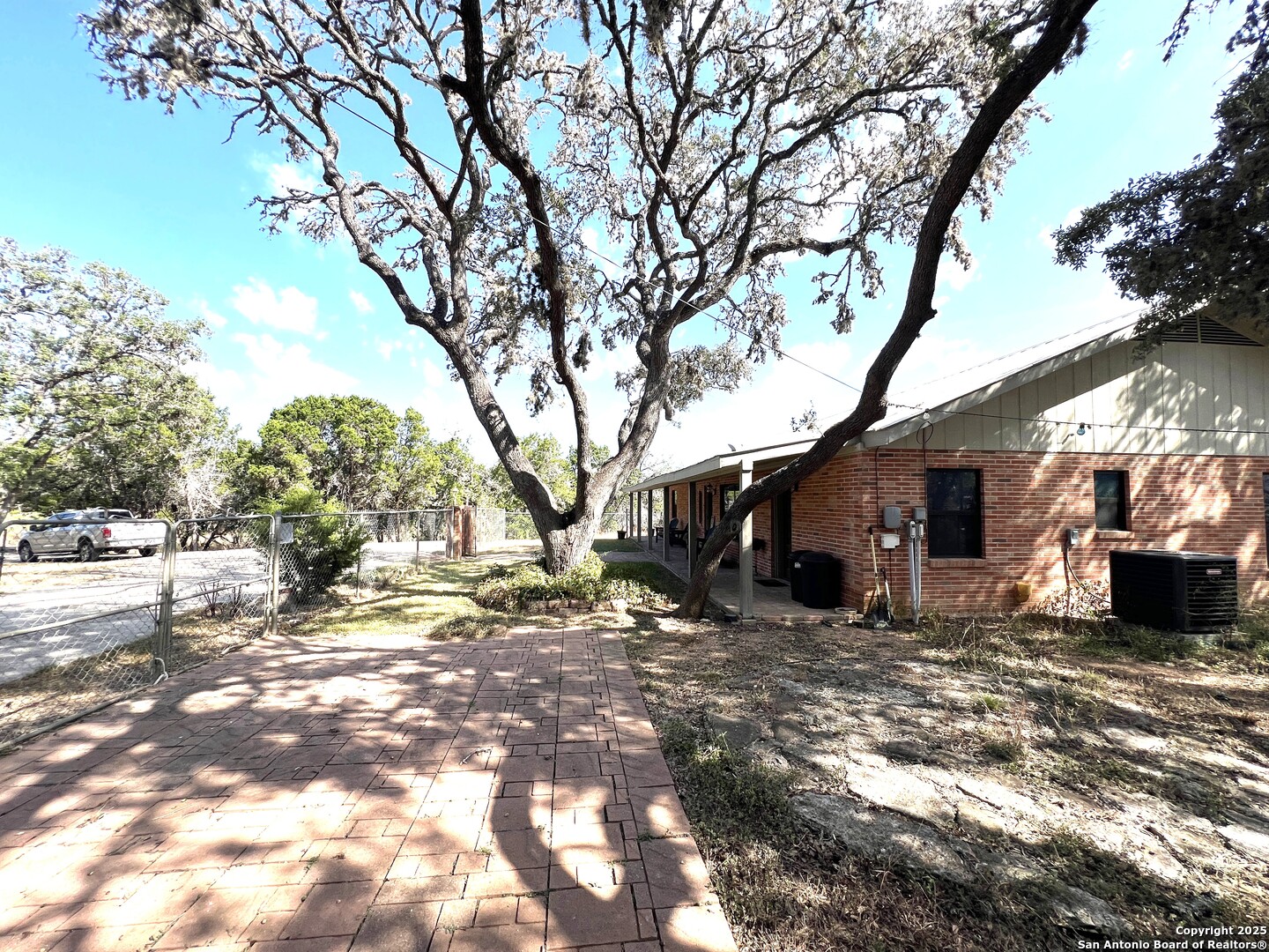 630 Indian Mound Road Tarpley, TX 78883 - Photo 93 of 96 a view of a yard with a tree in the house