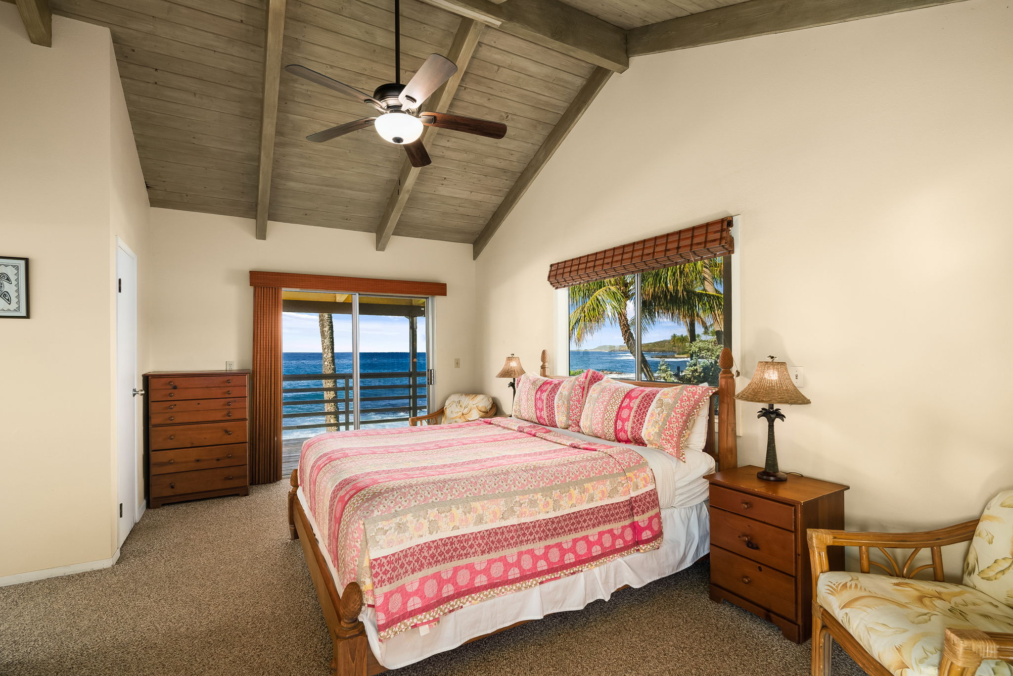 4770 Lawai Road Koloa, HI 96756 - Photo 9 of 19 a bedroom with a bed and a chandelier