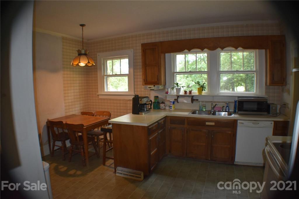 3670 Union Road Gastonia, NC 28056 - Photo 15 of 41 a kitchen with a table chairs and microwave
