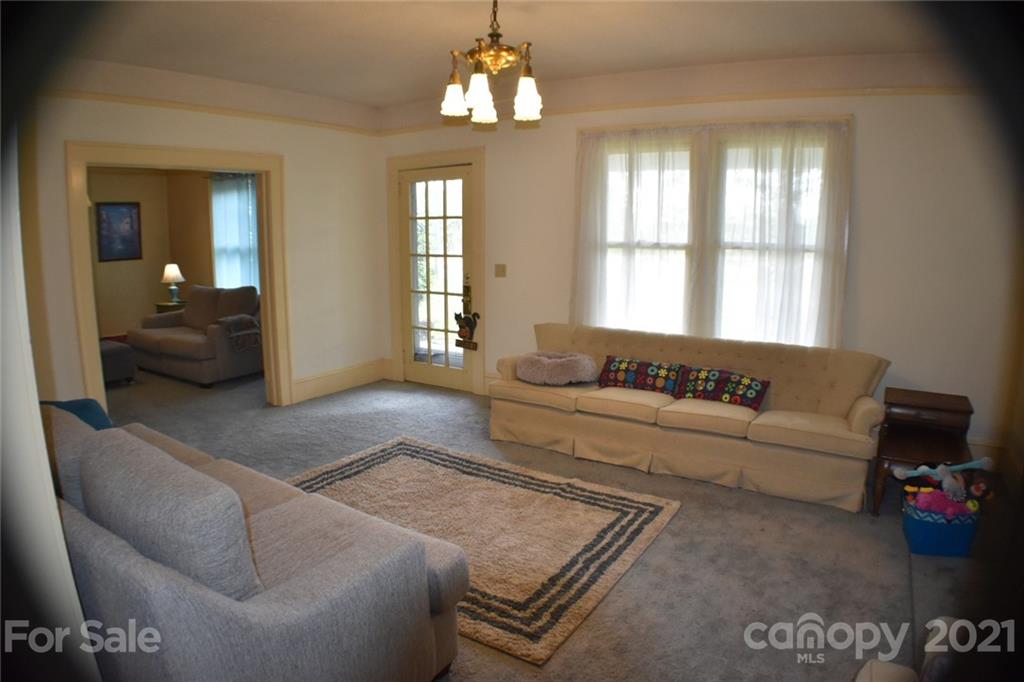 3670 Union Road Gastonia, NC 28056 - Photo 9 of 41 a living room with furniture and a chandelier
