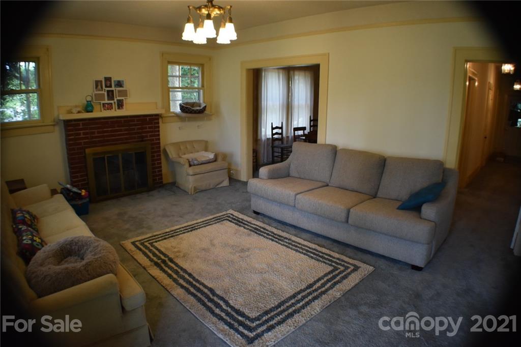 3670 Union Road Gastonia, NC 28056 - Photo 10 of 41 a living room with furniture and a chandelier