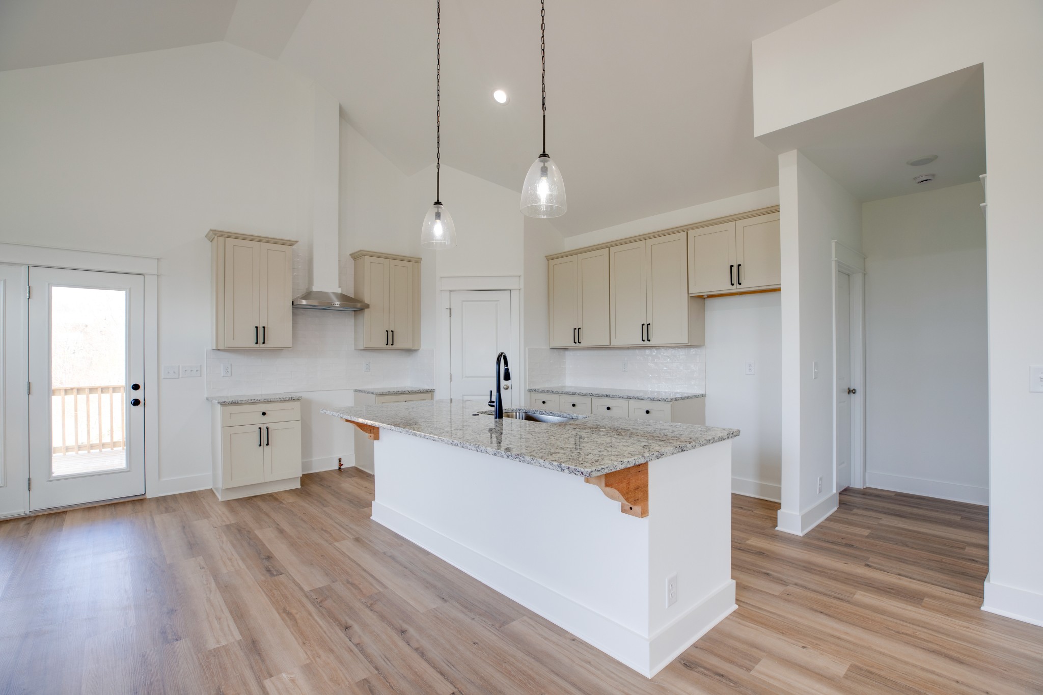 2802 Lock Hollow Road Dickson, TN 37055 - Photo 12 of 34 a large kitchen with cabinets wooden floor and stainless steel appliances
