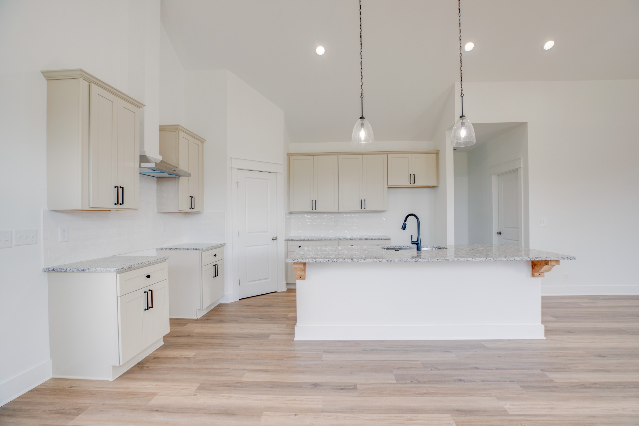 2802 Lock Hollow Road Dickson, TN 37055 - Photo 13 of 34 a large white kitchen with wooden floor