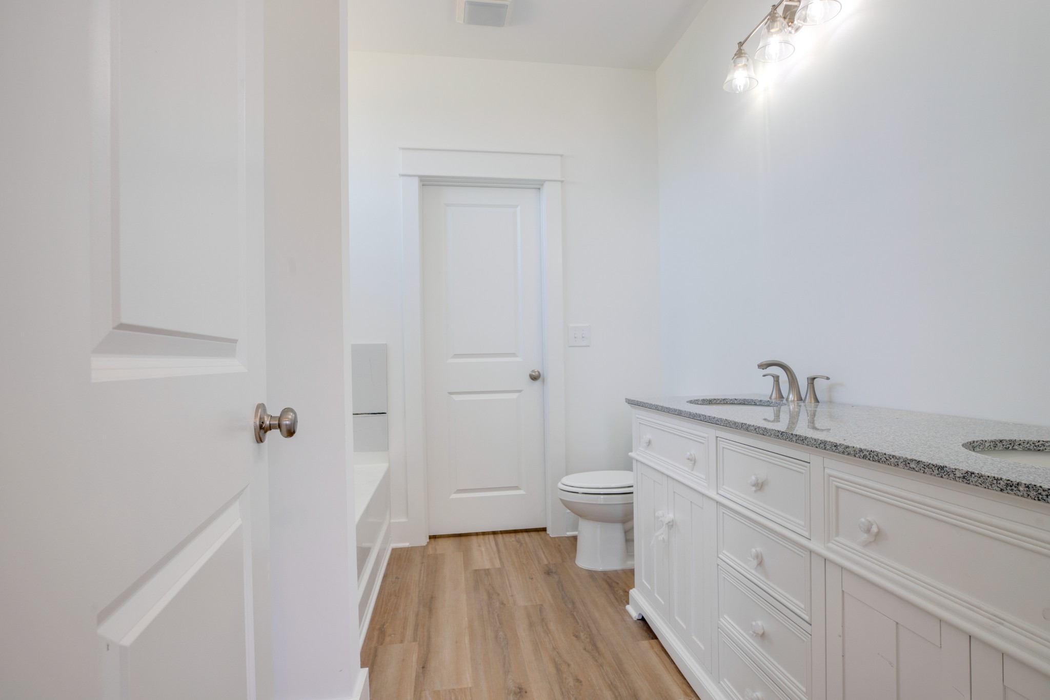 2802 Lock Hollow Road Dickson, TN 37055 - Photo 22 of 34 a bathroom with a granite countertop toilet and sink