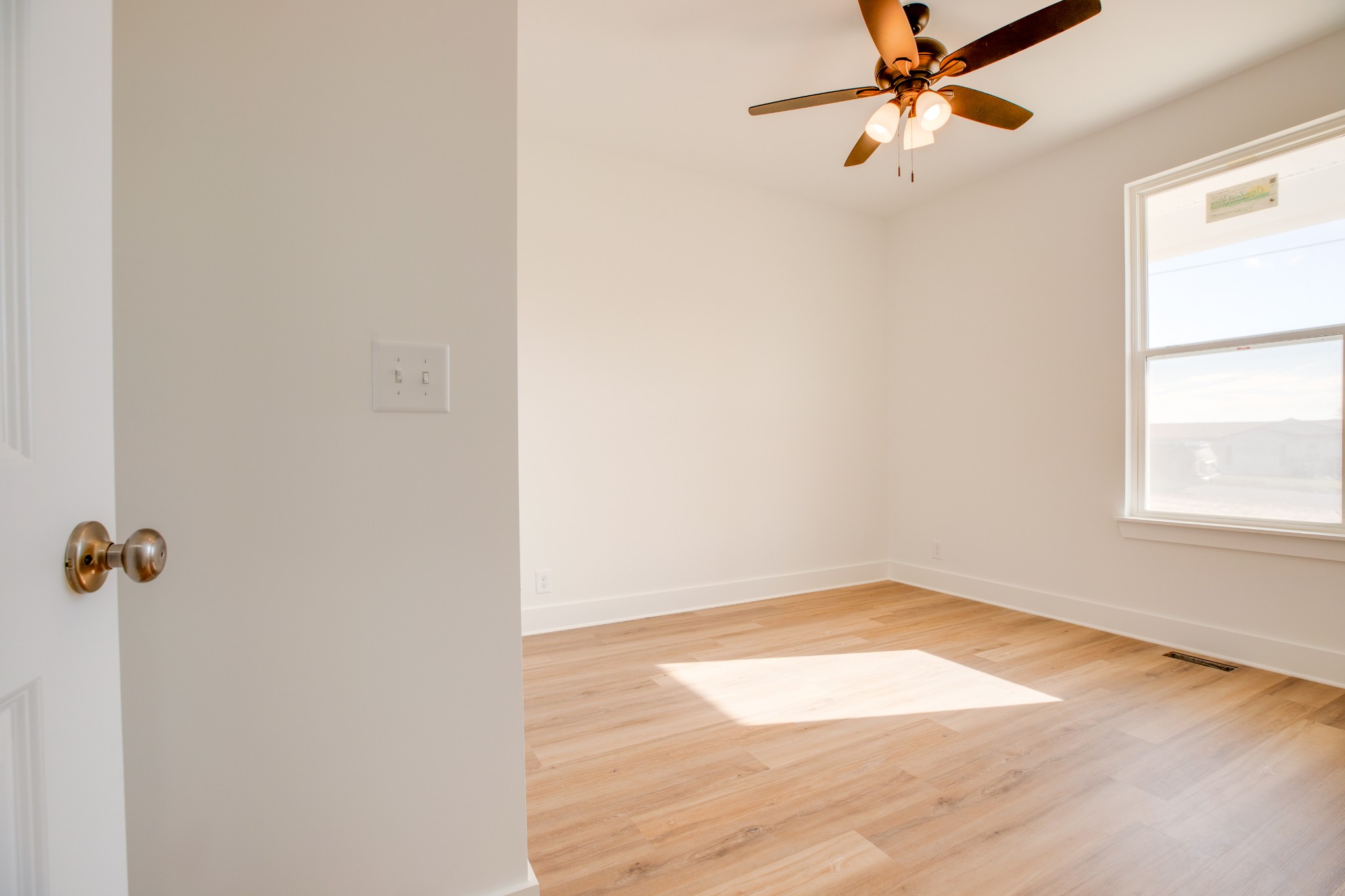 2802 Lock Hollow Road Dickson, TN 37055 - Photo 25 of 34 an empty room with a window and a fan