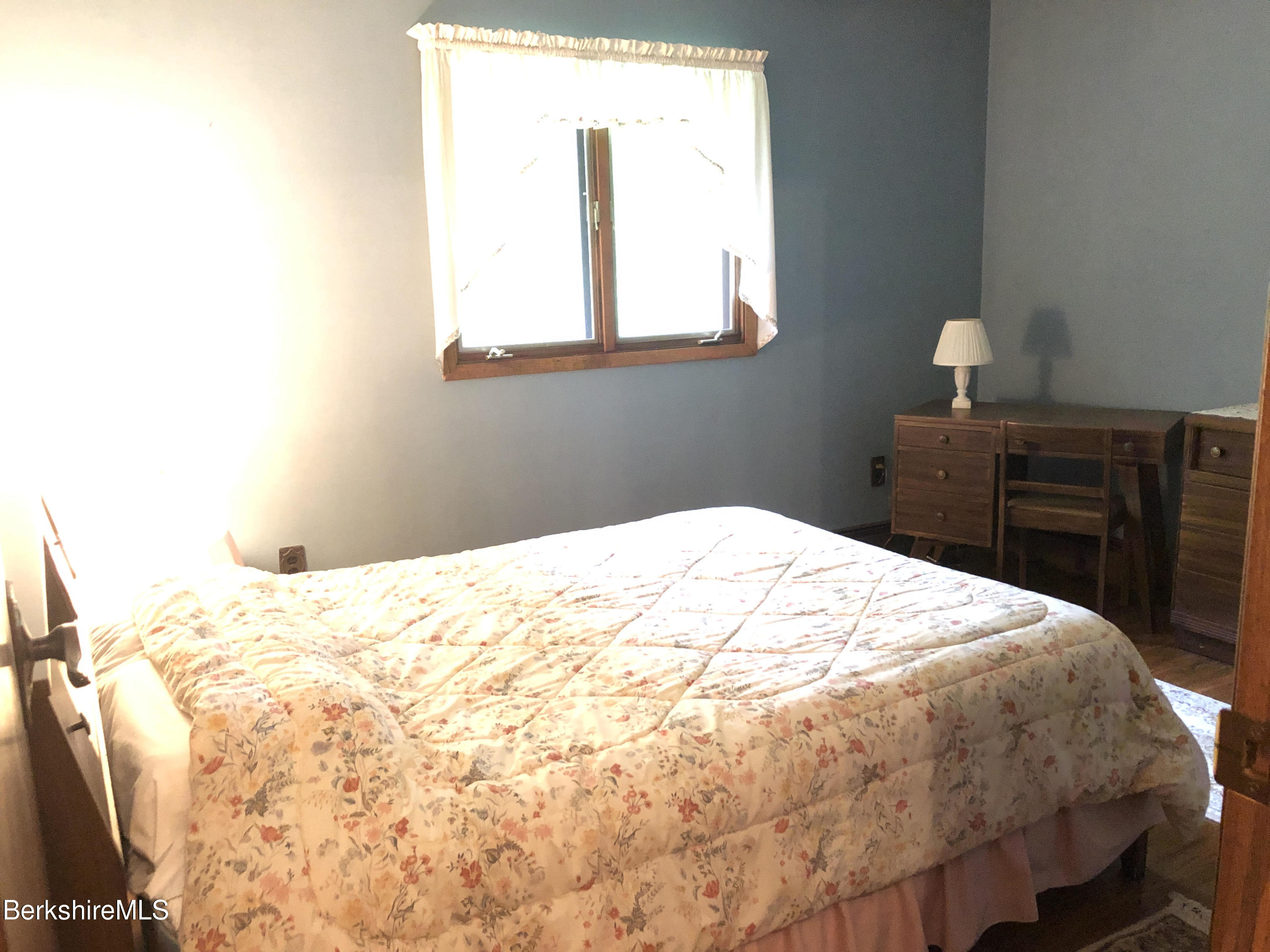 35 Pine Knoll Road Lenox, MA 01240 - Photo 16 of 26 a bedroom with a bed and a window