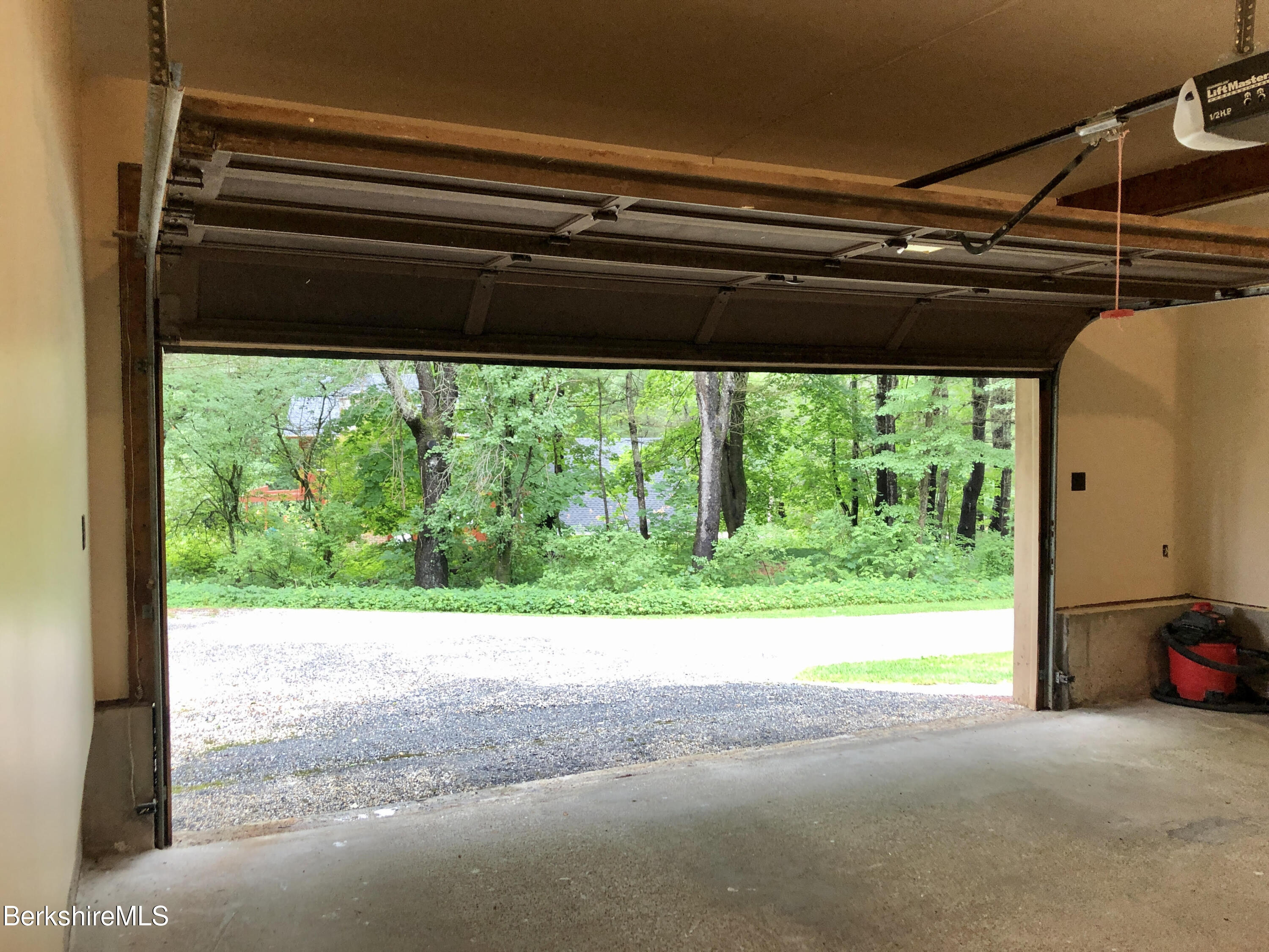 35 Pine Knoll Road Lenox, MA 01240 - Photo 22 of 26 a view of a room with a large window and a small space