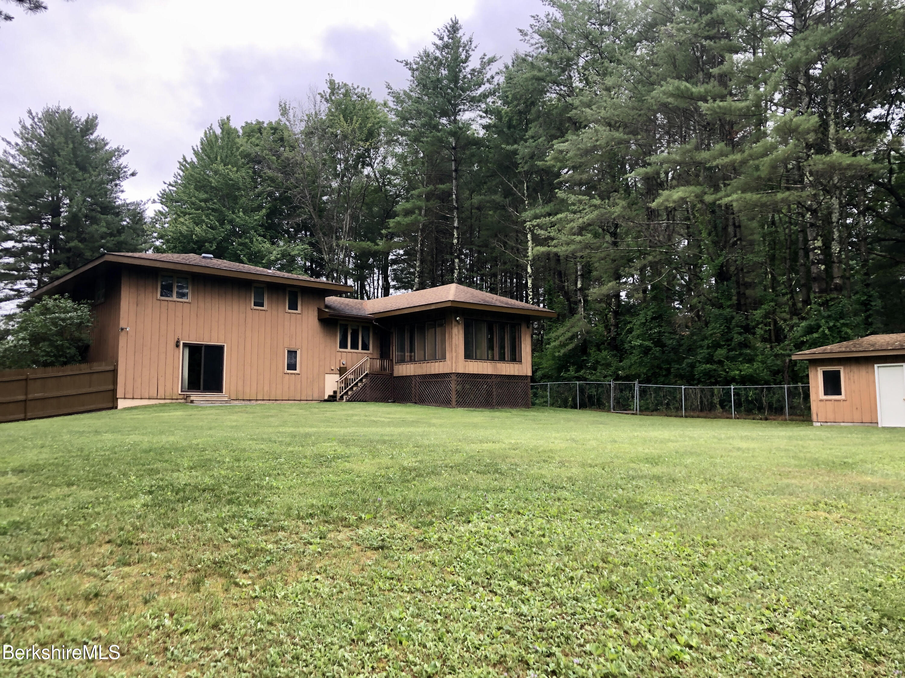 35 Pine Knoll Road Lenox, MA 01240 - Photo 23 of 26 a house with trees in the background