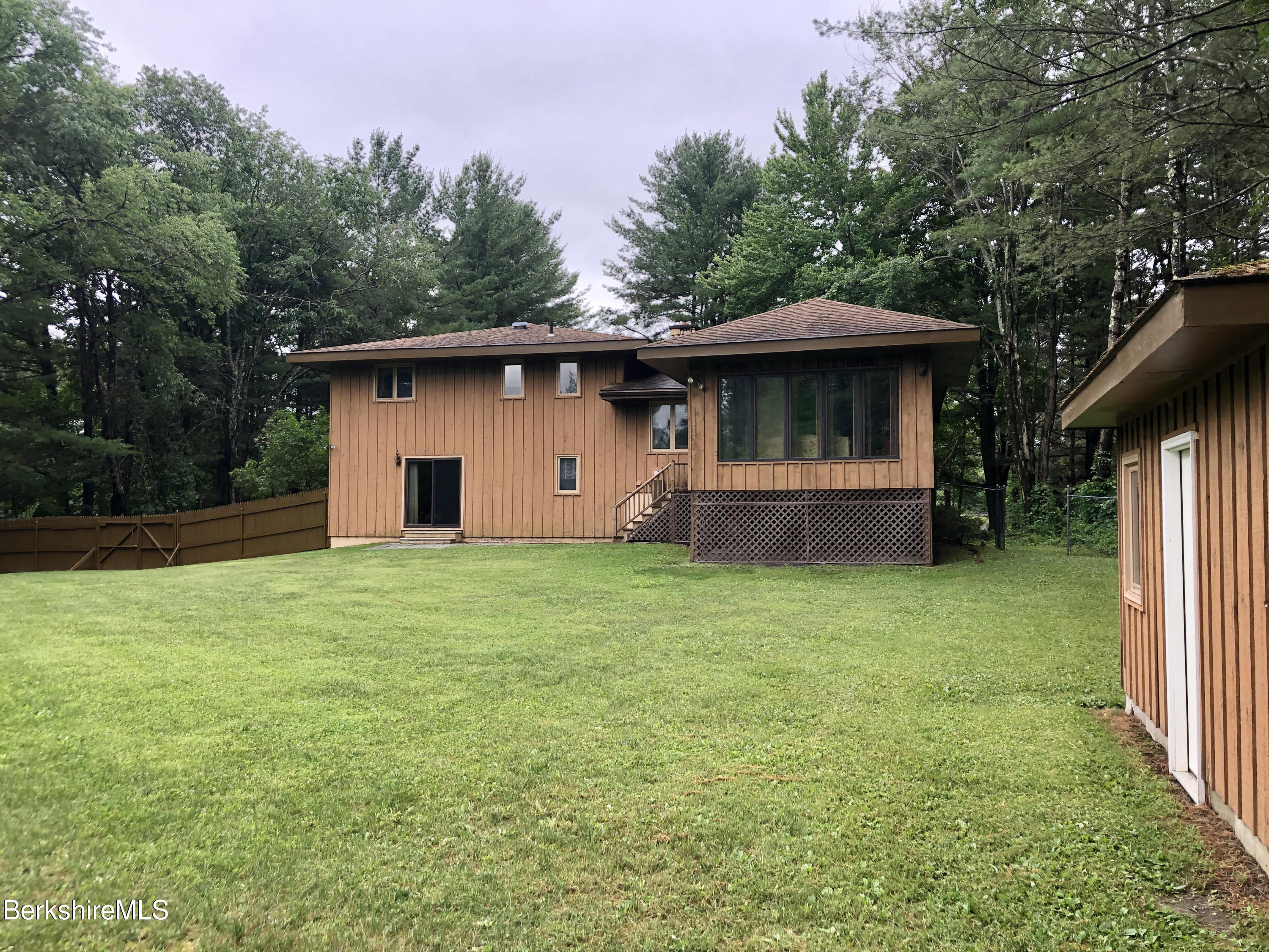 35 Pine Knoll Road Lenox, MA 01240 - Photo 24 of 26 a backyard of a house with lots of green space