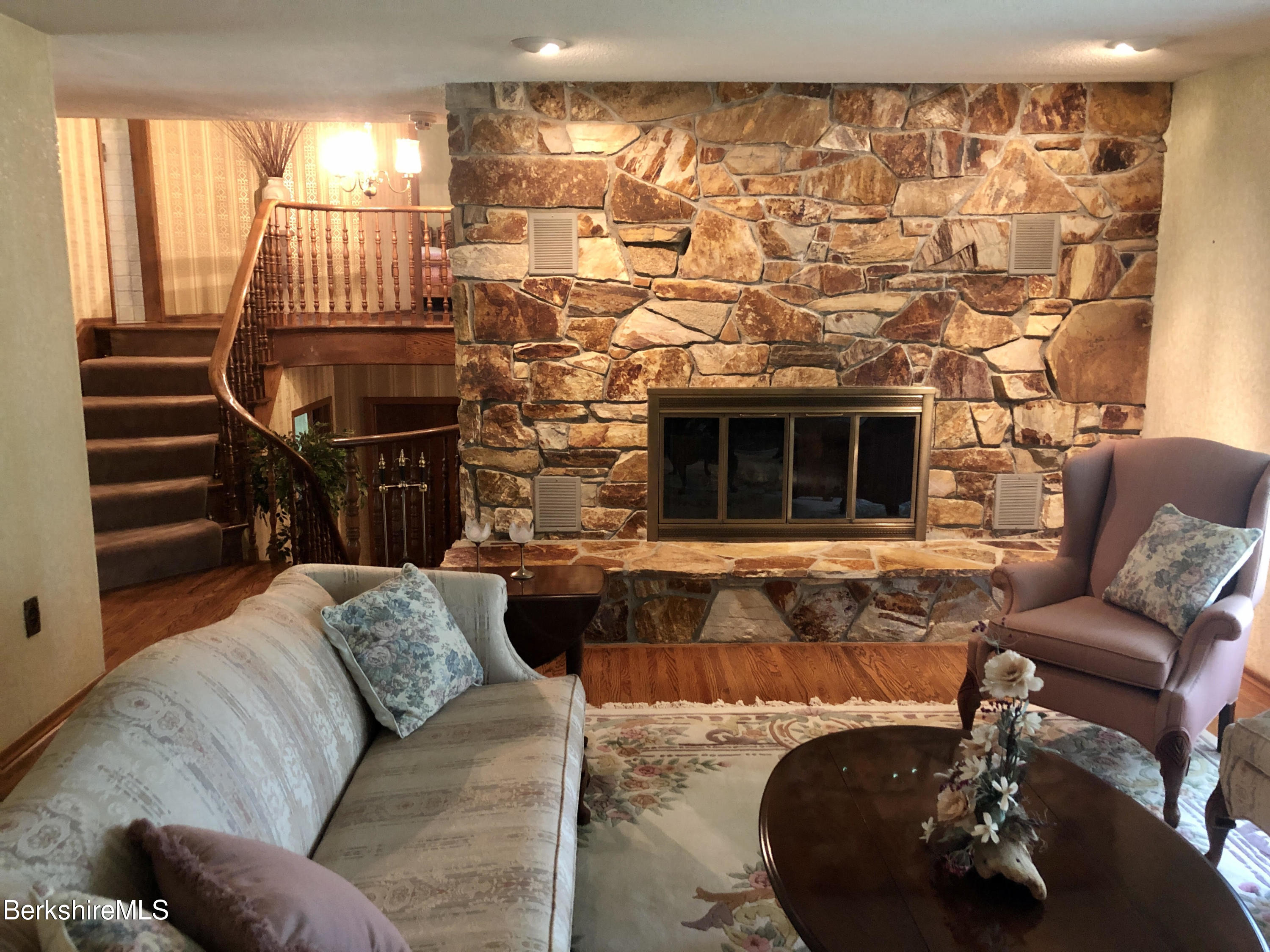 35 Pine Knoll Road Lenox, MA 01240 - Photo 5 of 26 a living room with furniture and a fireplace